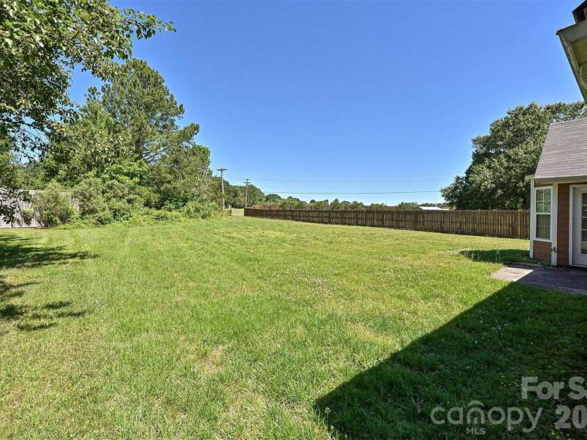 4922 Alexis Drive, Indian Trail, NC 28079.  MLS# CAR4382552, YatesRealty ID 22421. Back Yard
