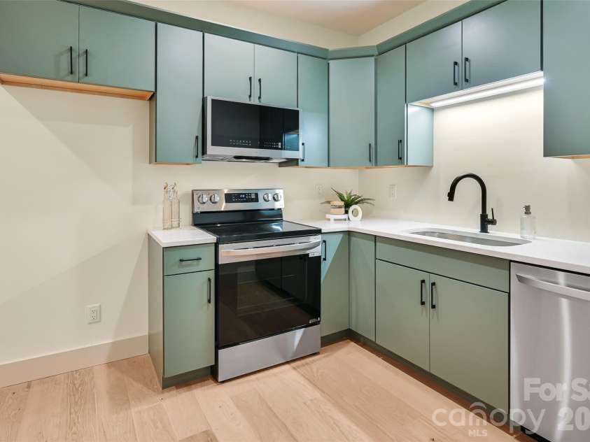 30 Sand Hill Road, Asheville, NC 28806.  MLS# CAR4382772, YatesRealty ID 22422. Basement level full kitchen with abundant storage