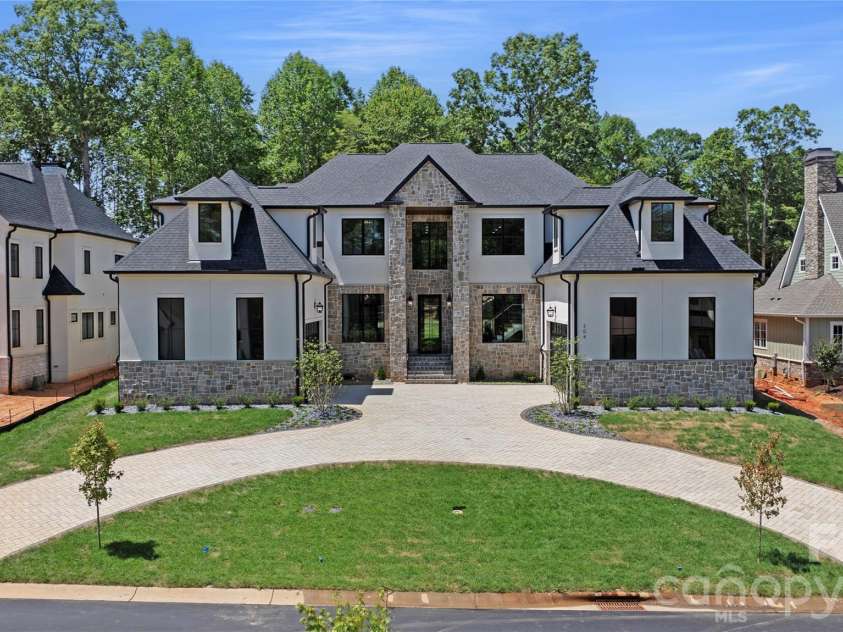 509 Sugar Maple Lane, Weddington, NC 28104.  MLS# CAR4336695, YatesRealty ID 2243. Previous build of same house plan.  Front Elevation.  Brick, stone, colors can be changed