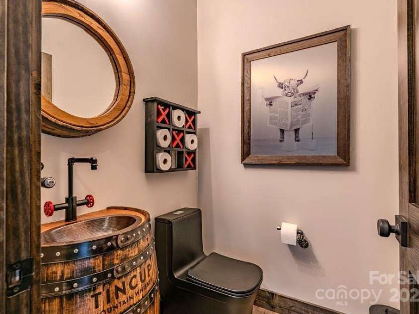 706 Silver Springs Drive, Banner Elk, NC 28604.  MLS# CAR4275009, YatesRealty ID 22440. Game area half bath Lower level