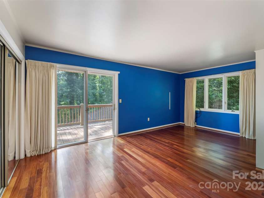 684 Woodfield Drive, Waynesville, NC 28786.  MLS# CAR4269678, YatesRealty ID 22443. Bedroom #2 features mirrored closet and access to deck.