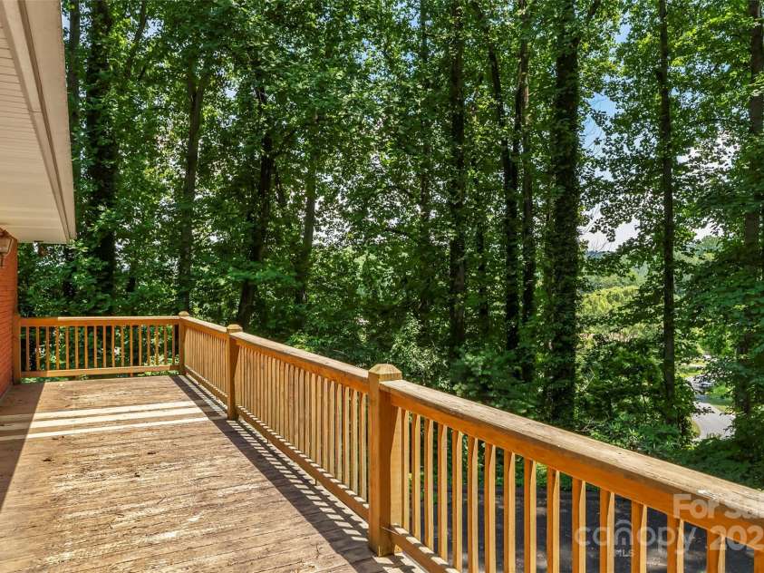 684 Woodfield Drive, Waynesville, NC 28786.  MLS# CAR4269678, YatesRealty ID 22443. Catch long range winter views from the upper deck in colder months.