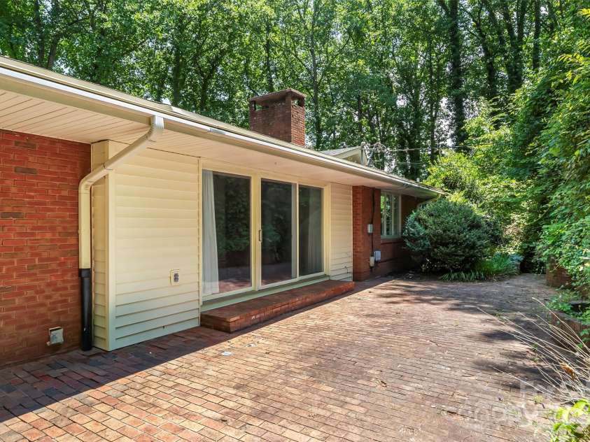 684 Woodfield Drive, Waynesville, NC 28786.  MLS# CAR4269678, YatesRealty ID 22443. Enjoy both sun and shade on the brick patio!