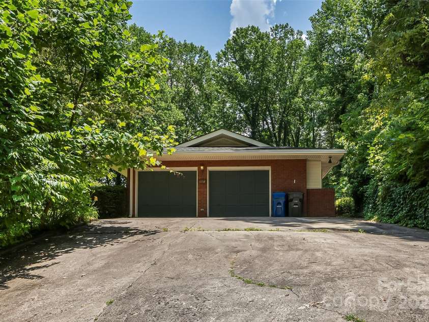 684 Woodfield Drive, Waynesville, NC 28786.  MLS# CAR4269678, YatesRealty ID 22443. Main driveway with attached 2-car garage