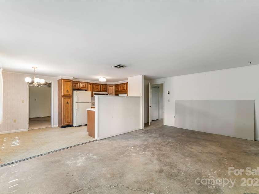 684 Woodfield Drive, Waynesville, NC 28786.  MLS# CAR4269678, YatesRealty ID 22443. Unfinished basement apartment view from living room