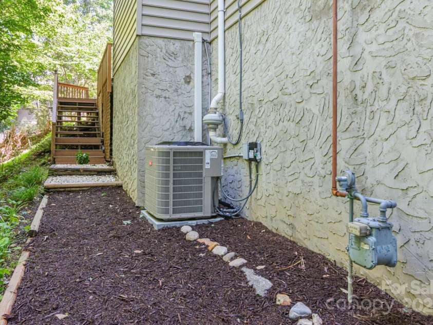 299 Carriage Summitt Way, Hendersonville, NC 28791.  MLS# CAR4305616, YatesRealty ID 22447. Exterior - West Side