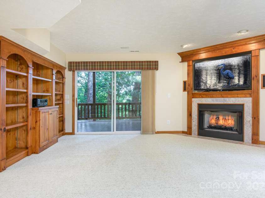 299 Carriage Summitt Way, Hendersonville, NC 28791.  MLS# CAR4305616, YatesRealty ID 22447. Lower Family Room