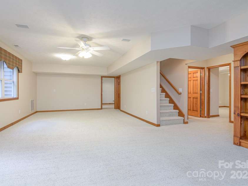 299 Carriage Summitt Way, Hendersonville, NC 28791.  MLS# CAR4305616, YatesRealty ID 22447. Lower Family Room