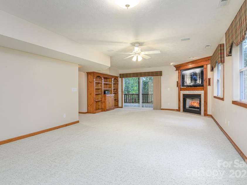 299 Carriage Summitt Way, Hendersonville, NC 28791.  MLS# CAR4305616, YatesRealty ID 22447. Lower Family Room