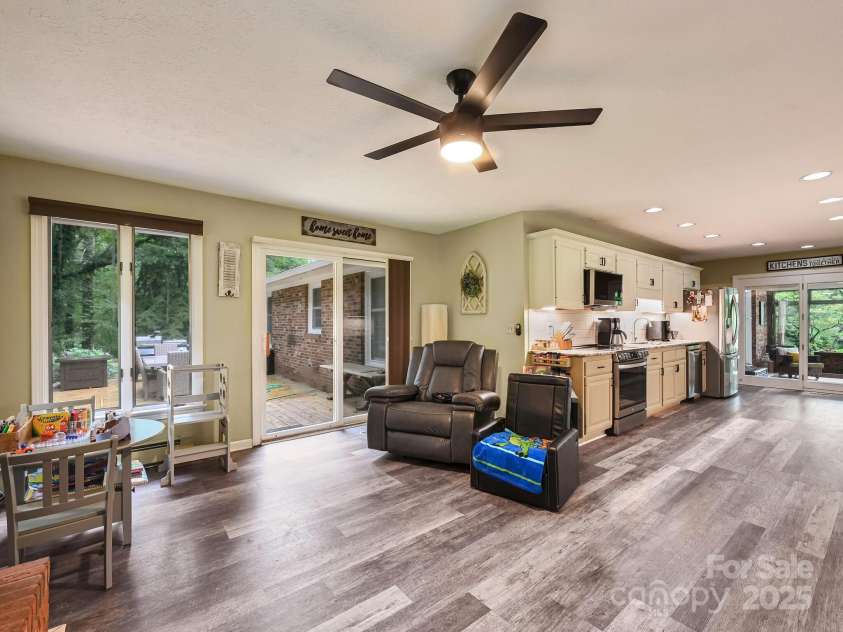 3221 Debbie Drive, Hendersonville, NC 28791.  MLS# CAR4255457, YatesRealty ID 22453. Family Room Looks onto the Deck