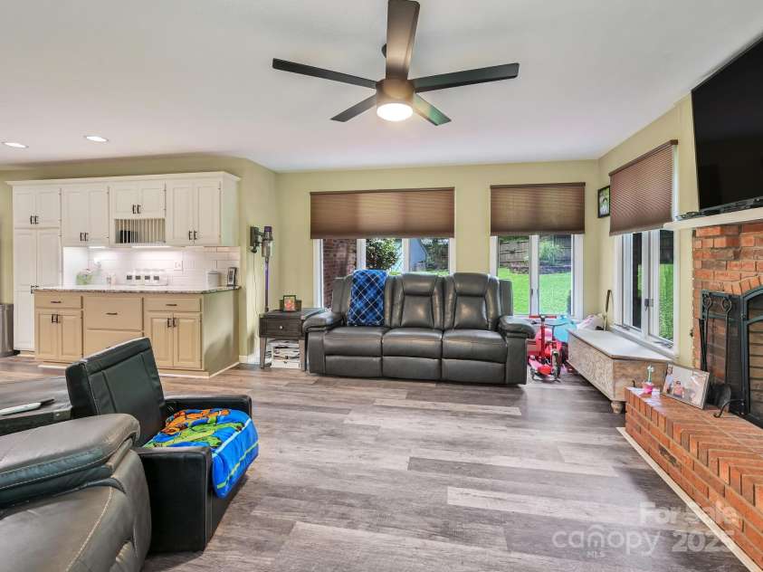 3221 Debbie Drive, Hendersonville, NC 28791.  MLS# CAR4255457, YatesRealty ID 22453. Fireplace in Family Room Wood Burning