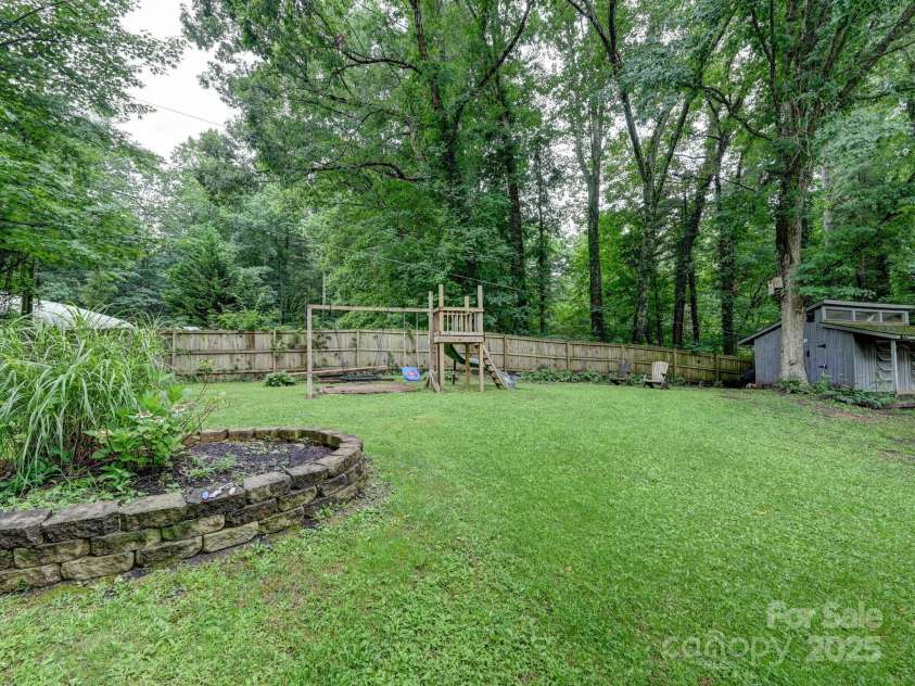 3221 Debbie Drive, Hendersonville, NC 28791.  MLS# CAR4255457, YatesRealty ID 22453. Garden Bed With Play Area Conveys