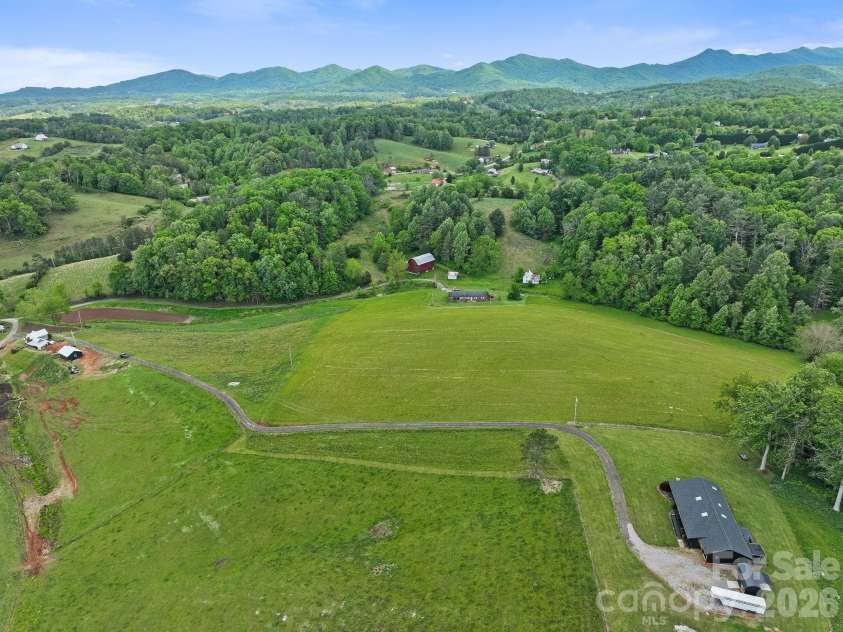 52 Will Smith Lane, Leicester, NC 28748.  MLS# CAR4379317, YatesRealty ID 22454. Aerial view from back of property.