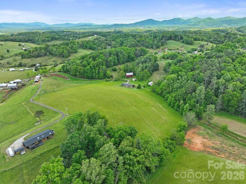 52 Will Smith Lane, Leicester, NC 28748.  MLS# CAR4379317, YatesRealty ID 22454. Aerial view from back of property.