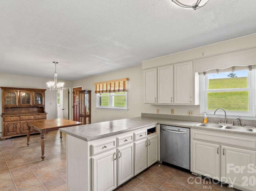 52 Will Smith Lane, Leicester, NC 28748.  MLS# CAR4379317, YatesRealty ID 22454. Kitchen & Dining Area
