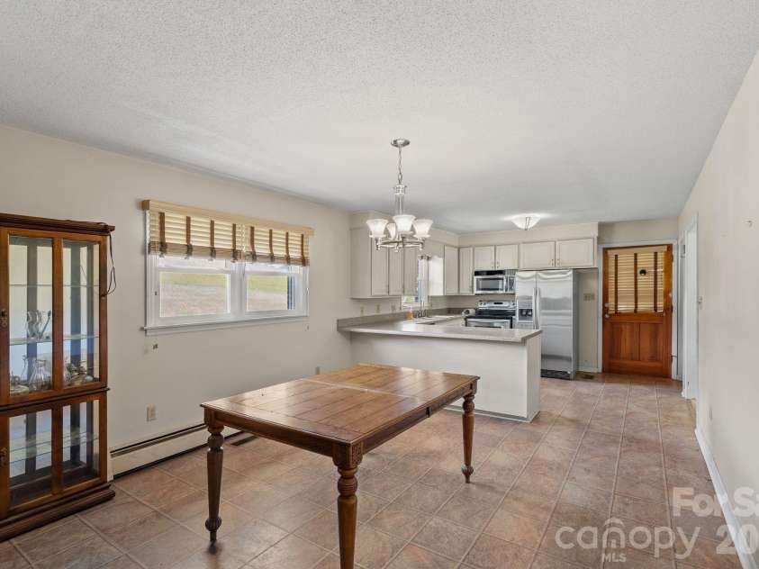 52 Will Smith Lane, Leicester, NC 28748.  MLS# CAR4379317, YatesRealty ID 22454. Kitchen/Dining 