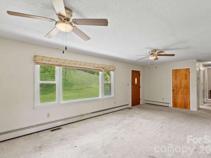 52 Will Smith Lane, Leicester, NC 28748.  MLS# CAR4379317, YatesRealty ID 22454. Living Room