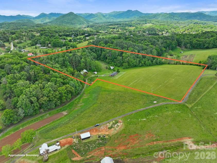 52 Will Smith Lane, Leicester, NC 28748.  MLS# CAR4379317, YatesRealty ID 22454. Open space begging for some horses!