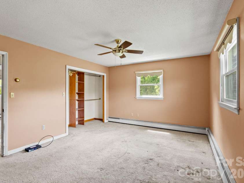 52 Will Smith Lane, Leicester, NC 28748.  MLS# CAR4379317, YatesRealty ID 22454. Primary Bedroom
