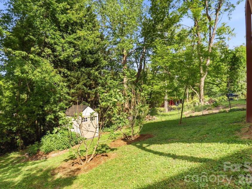 48 Mardell Circle, Asheville, NC 28806.  MLS# CAR4378796, YatesRealty ID 22461. Tree-lined with Storage Shed