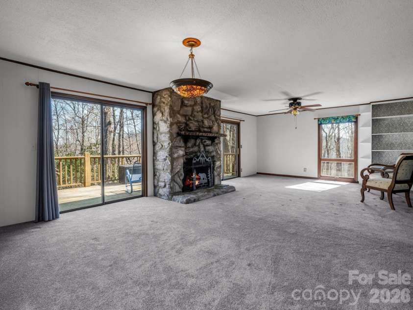 177 Tsisqua Circle, Brevard, NC 28712.  MLS# CAR4341526, YatesRealty ID 22465. Dining and living room