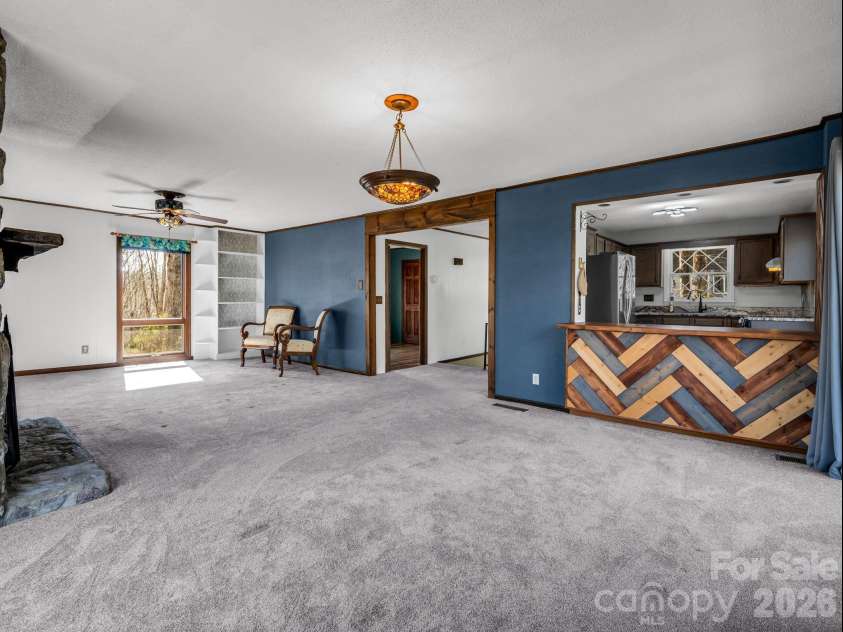 177 Tsisqua Circle, Brevard, NC 28712.  MLS# CAR4341526, YatesRealty ID 22465. Living and dining room