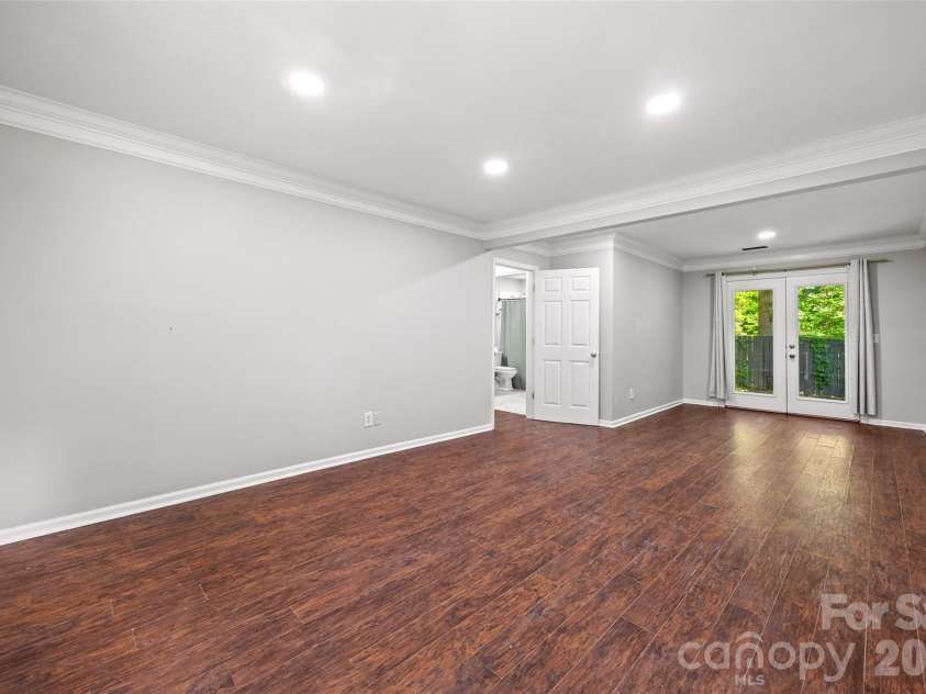 204 Swamp Fox Drive, Fort Mill, SC 29715.  MLS# CAR4368341, YatesRealty ID 22466. Bedroom on lower level with exit to rear patio