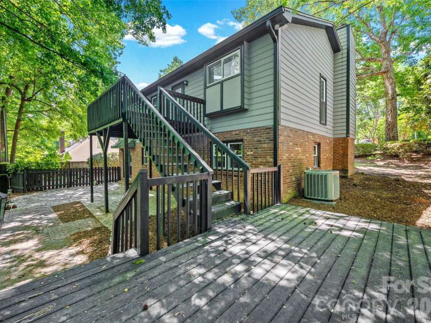 204 Swamp Fox Drive, Fort Mill, SC 29715.  MLS# CAR4368341, YatesRealty ID 22466. Private backyard with multi-level deck and patio