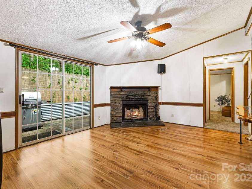 15 Robin Lane, Asheville, NC 28806.  MLS# CAR4254929, YatesRealty ID 22472. Wood burning fireplace