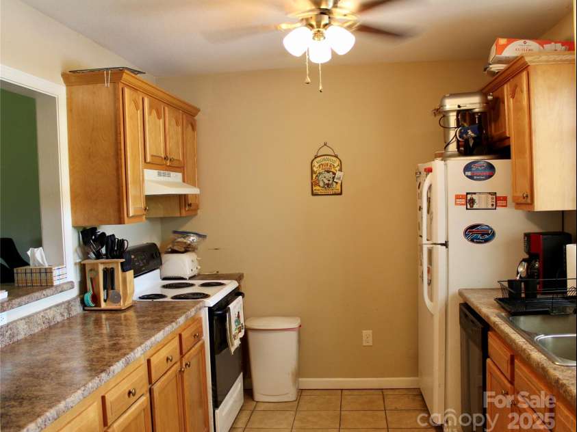 50 Duncan Road, Flat Rock, NC 28731.  MLS# CAR4274079, YatesRealty ID 22481. Kitchen with tile floor