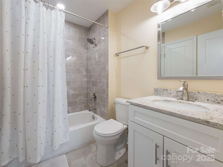 4506 Breakers Lane, Asheville, NC 28806.  MLS# CAR4273310, YatesRealty ID 22485. Beautifully finished bath with access from guest suite or common area.