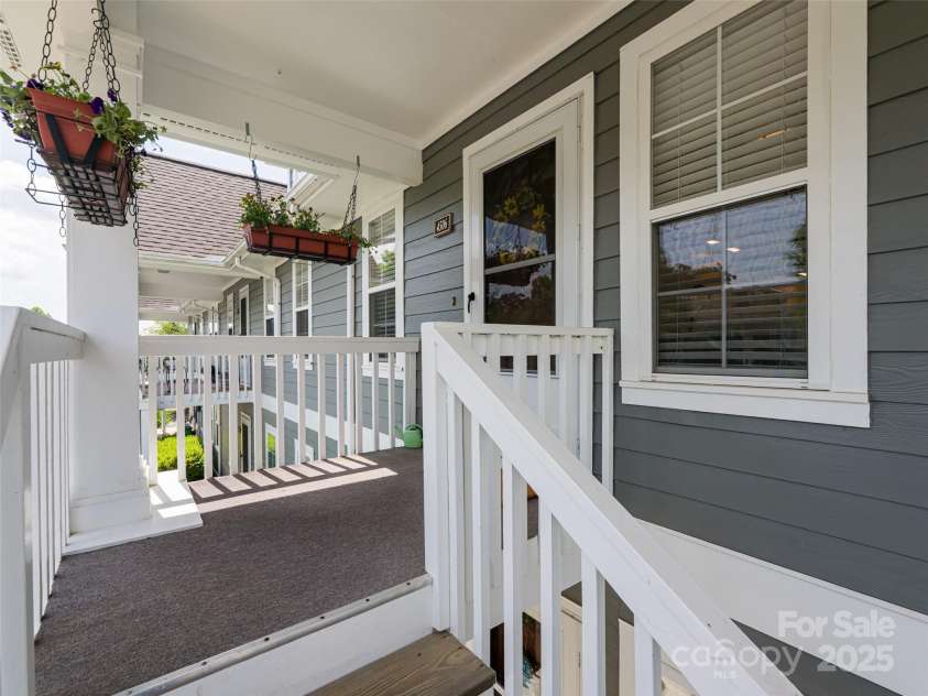 4506 Breakers Lane, Asheville, NC 28806.  MLS# CAR4273310, YatesRealty ID 22485. This house has a nice, cozy front porch.  You can get right from the parking lot to the house, which is super convenient if you’ve got your hands full of groceries.