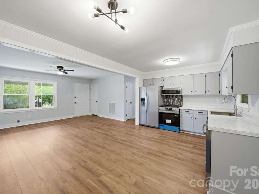 661 Kilborne Drive, Gastonia, NC 28052.  MLS# CAR4363337, YatesRealty ID 22487. Dining Area and Kitchen looking into Living Room 