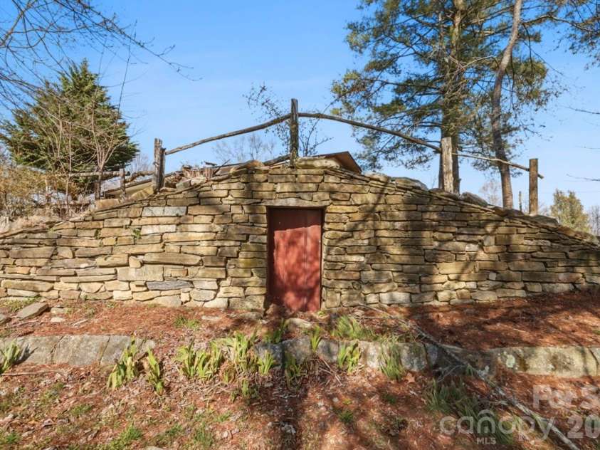 1032 Brightwater Drive, Hendersonville, NC 28739.  MLS# CAR4361176, YatesRealty ID 22490. ...and a wine cellar built into the hillside!