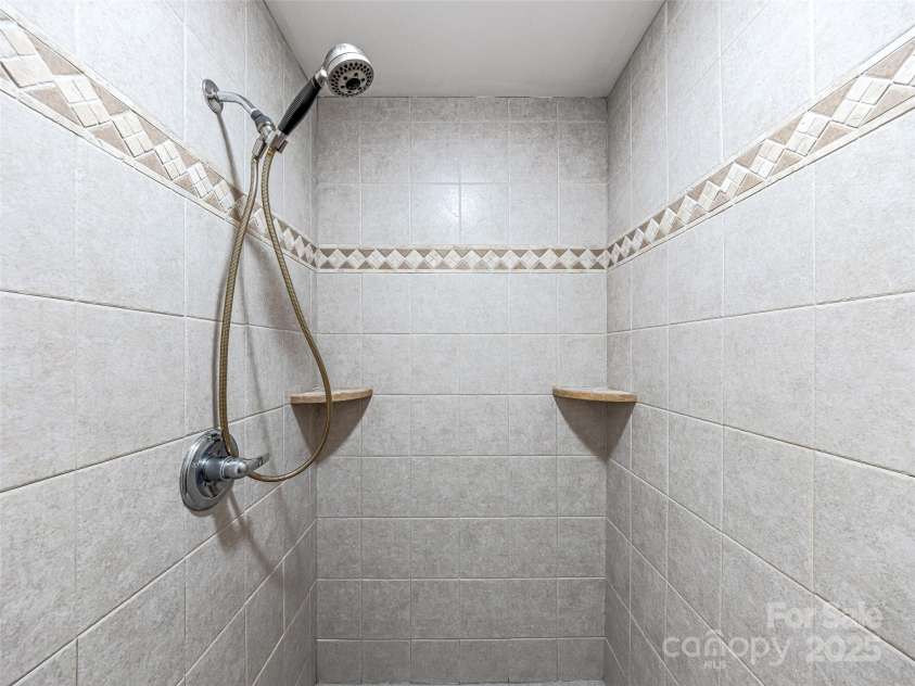 12 Whitleigh Court, Arden, NC 28704.  MLS# CAR4275811, YatesRealty ID 22492. Oversized Primary Shower
