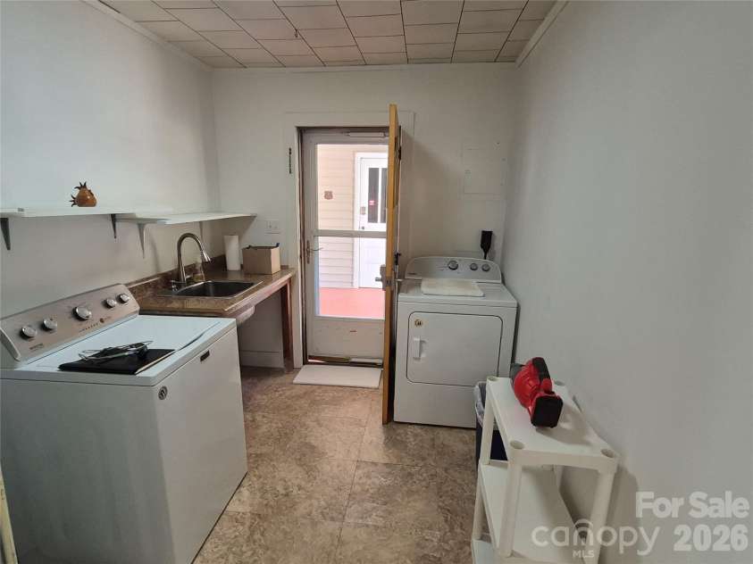 5 Gibson Drive, Maggie Valley, NC 28751.  MLS# CAR4379068, YatesRealty ID 22492. Carport in back
