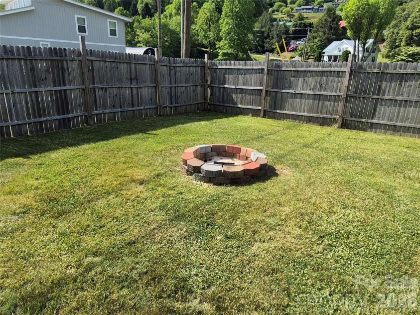 5 Gibson Drive, Maggie Valley, NC 28751.  MLS# CAR4379068, YatesRealty ID 22492. Firepit area