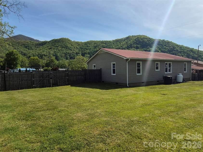 5 Gibson Drive, Maggie Valley, NC 28751.  MLS# CAR4379068, YatesRealty ID 22492. View from back