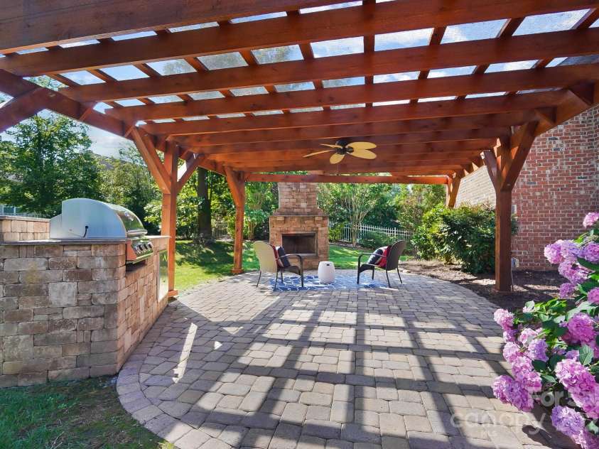 4009 Oxford Mill Road, Waxhaw, NC 28173.  MLS# CAR4267673, YatesRealty ID 22496. Pergola has electricity for those beautiful hanging lights!