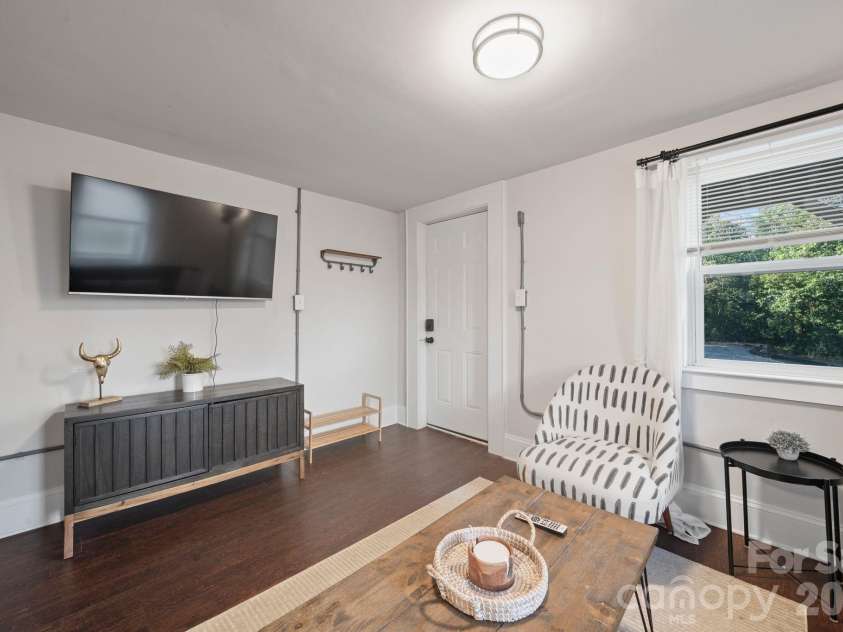 3720 Tuckaseegee Road, Charlotte, NC 28208.  MLS# CAR4356848, YatesRealty ID 22498. Basement living room. 