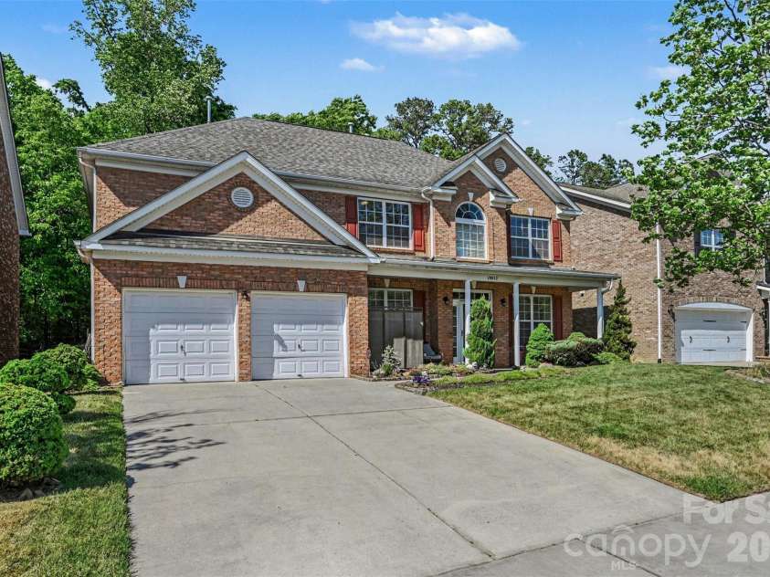 10812 Clark Street, Davidson, NC 28036.  MLS# CAR4372987, YatesRealty ID 22506. Brick and two-car garage