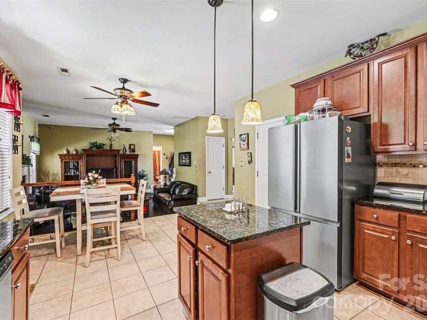 10812 Clark Street, Davidson, NC 28036.  MLS# CAR4372987, YatesRealty ID 22506. Kitchen flows directly into the dining room