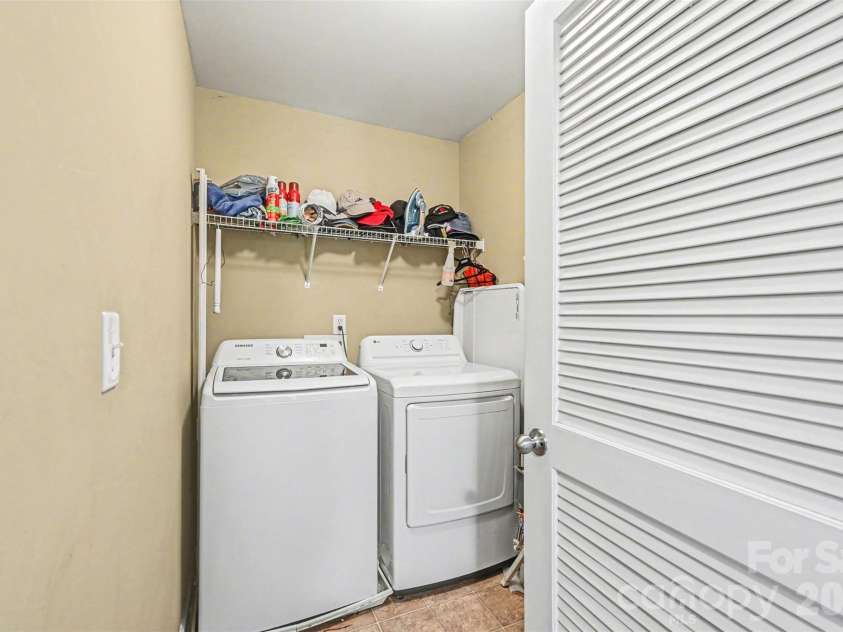 10812 Clark Street, Davidson, NC 28036.  MLS# CAR4372987, YatesRealty ID 22506. Upper level laundry room