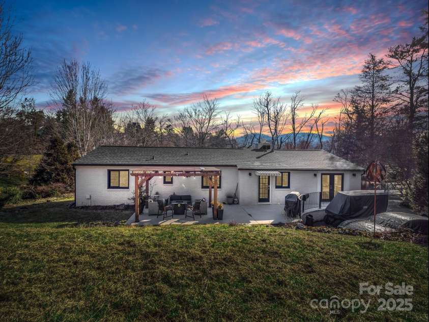 50 Midland Drive, Asheville, NC 28804.  MLS# CAR4223405, YatesRealty ID 2251. Back view at night