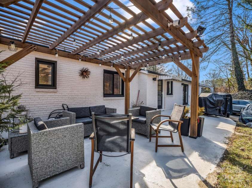 50 Midland Drive, Asheville, NC 28804.  MLS# CAR4223405, YatesRealty ID 2251. Patio under pergola