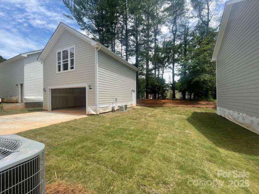 4017 Grommet Court, Matthews, NC 28105.  MLS# CAR4253909, YatesRealty ID 22516. 2 Car detached garage. Backs to protected tree area