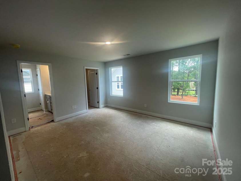 4017 Grommet Court, Matthews, NC 28105.  MLS# CAR4253909, YatesRealty ID 22516. Primary Bedroom with en suite and generous walk in closet