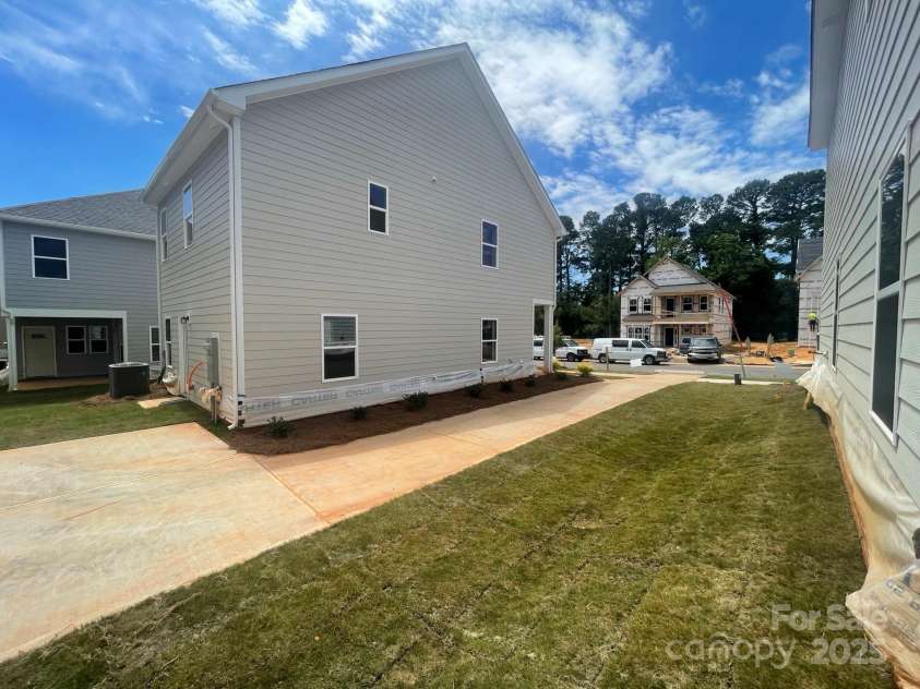 4017 Grommet Court, Matthews, NC 28105.  MLS# CAR4253909, YatesRealty ID 22516. Side Yard View