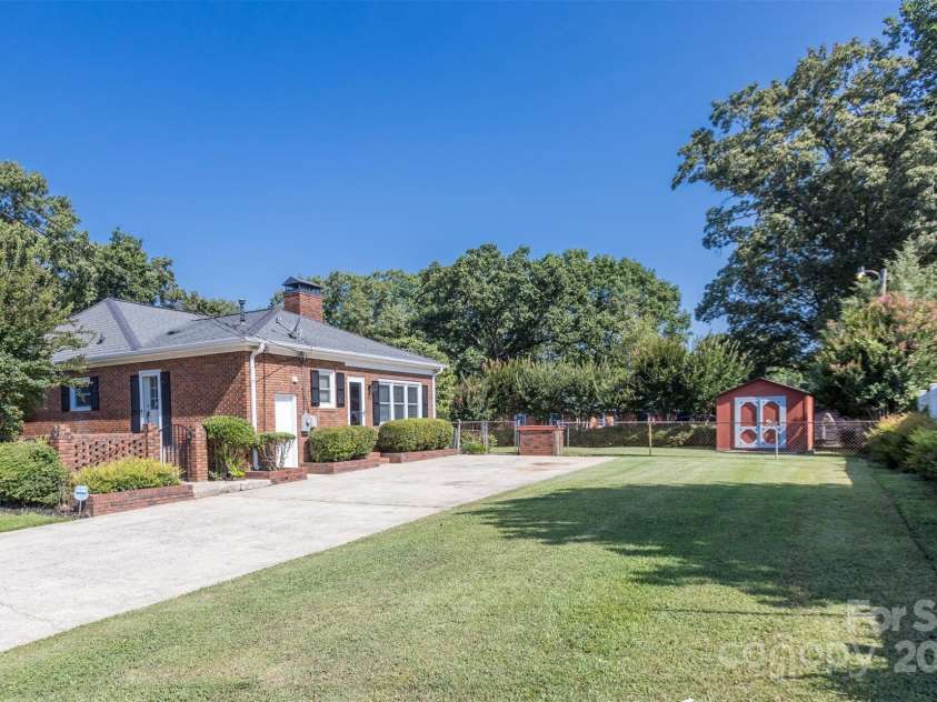 1280 Queensgate Street, Gastonia, NC 28054.  MLS# CAR4272559, YatesRealty ID 22518. Driveway side of home