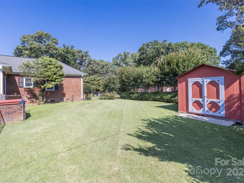 1280 Queensgate Street, Gastonia, NC 28054.  MLS# CAR4272559, YatesRealty ID 22518. Fenced portion of yard